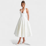 Inès - Textured Midi Dress" can be rewritten as "Inès - Stylish Textured Midi Dress.